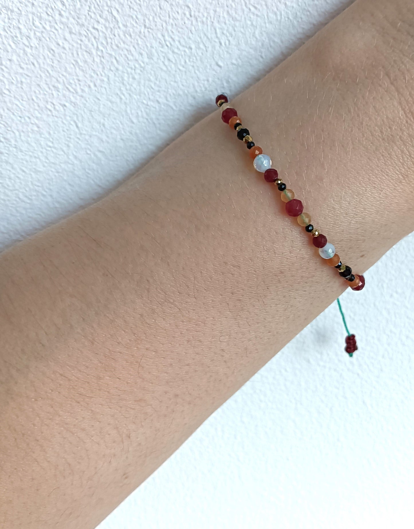 Bracelet made of natural stones. Aries zodiac sing.