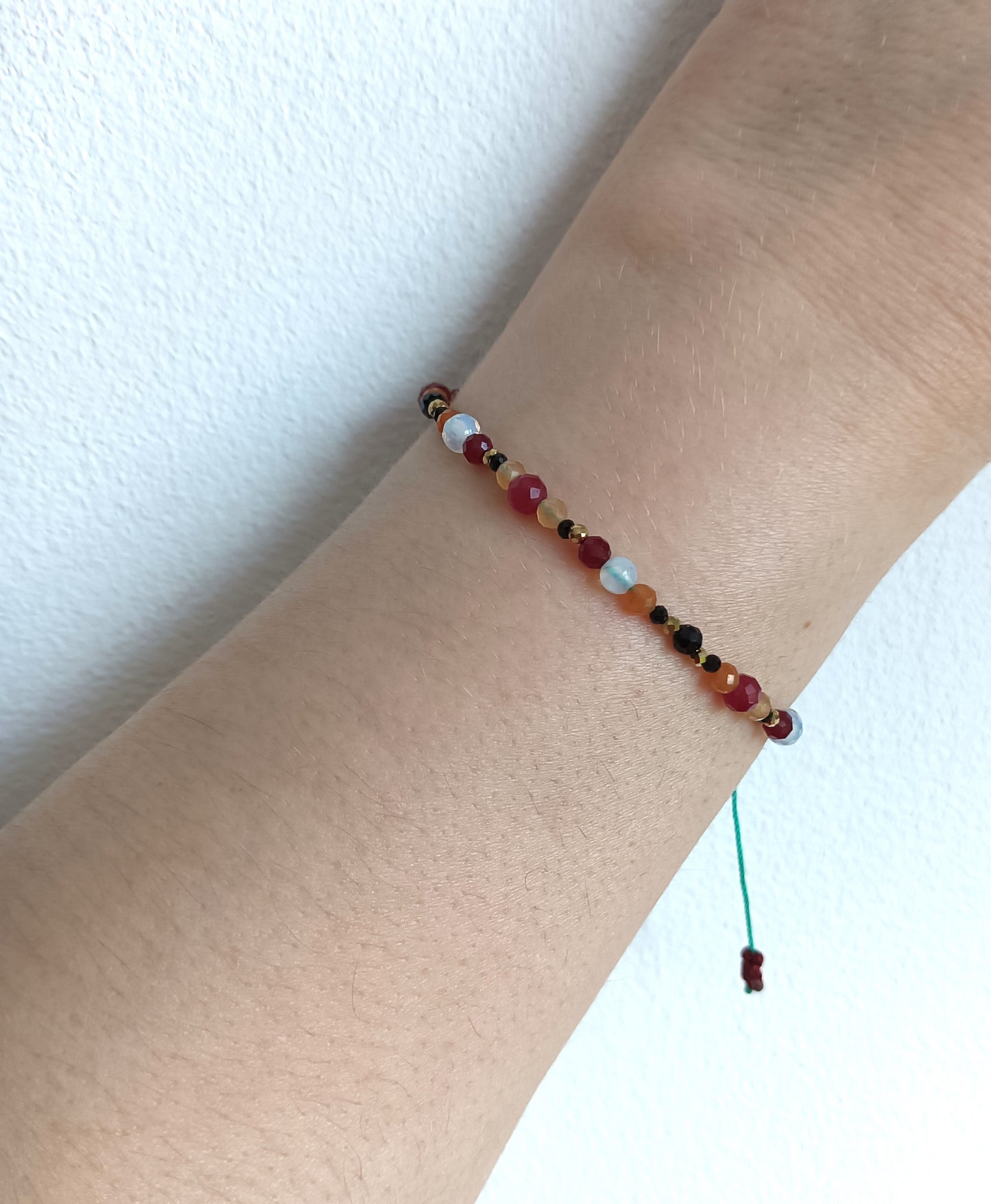Bracelet made of natural stones. Aries zodiac sing.